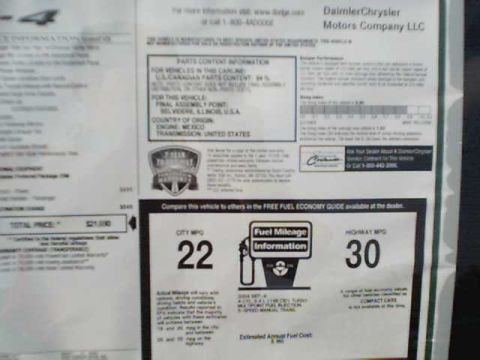 2000 Dodge Neon - A window sticker displays fuel economy ratings and other vehicle specifications.