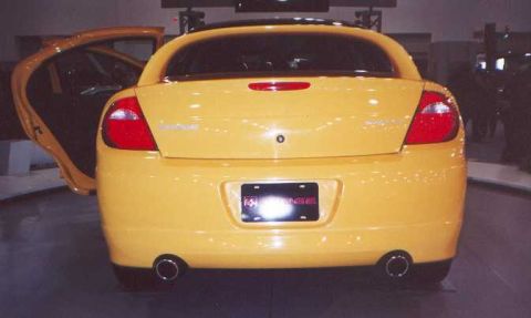 2000 Dodge Neon - Rear view of a yellow Dodge Neon with the driver's side door open.