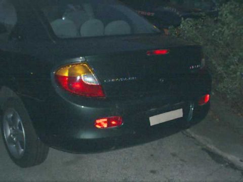 2000 Dodge Neon - Rear view of a dark-colored 2000 Dodge Neon sedan.