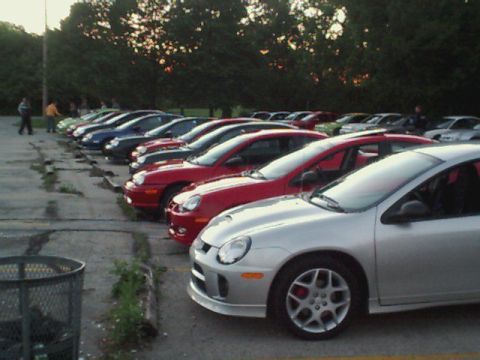 2000 Dodge Neon - A line of cars parked in a lot, with a silver Dodge Neon SRT-4 in the foreground.