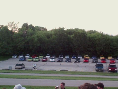 2000 Dodge Neon - A large parking lot filled with various cars under a bright sky.