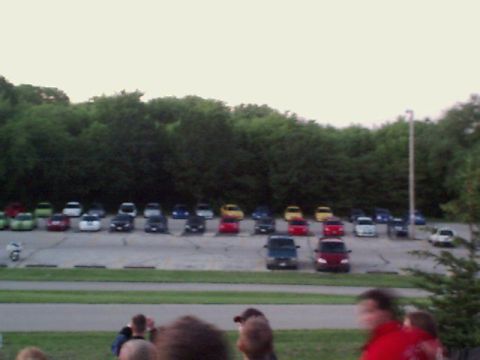 2000 Dodge Neon - A large group of vehicles are parked in an outdoor lot.