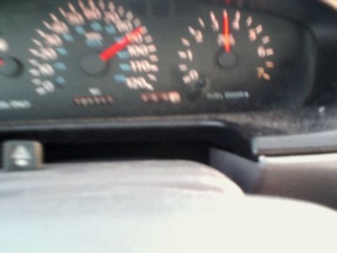 1995 Plymouth Neon - The dashboard shows a speedometer reading around 70 mph and an odometer reading of 101,911 miles.