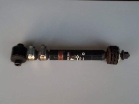 1995 Plymouth Neon - A close-up view of a tie rod end, showing some text and a red stripe.
