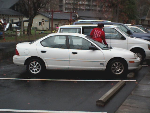 White 1995 Plymouth Neon sedan, side view