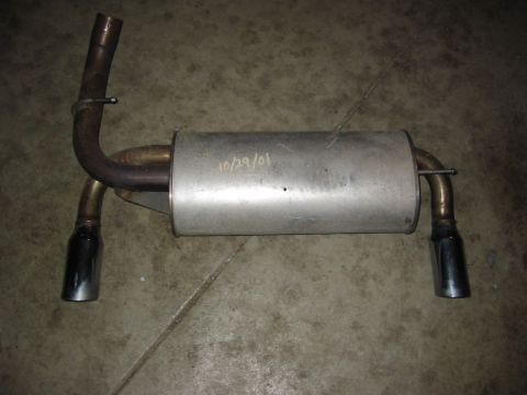 1995 Plymouth Neon - This is an aftermarket exhaust muffler assembly with dual chrome tips, showing a handwritten date of 10/29/01.