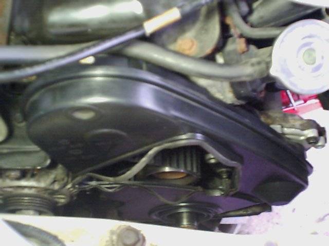 Engine timing belt cover and pulleys