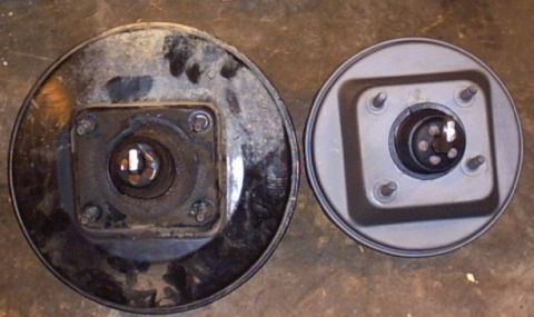 1991 Ford LTD Crown Victoria - Comparison of a used brake booster next to a clean, possibly new one.