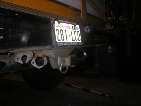 1978 Ford Bronco - The rear bumper of a vehicle is shown, a trailer hitch and a Washington state license plate.