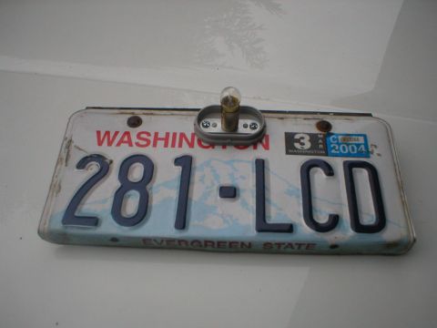 1978 Ford Bronco - Washington license plate 281-LCD, showing the expiration date of March 2004 and a license plate light.