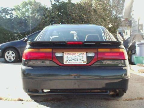 1994 Eagle Talon - The rear of a 1994 Eagle Talon is shown, with a Wisconsin license plate and a spoiler. Another vehicle is visible to the left.