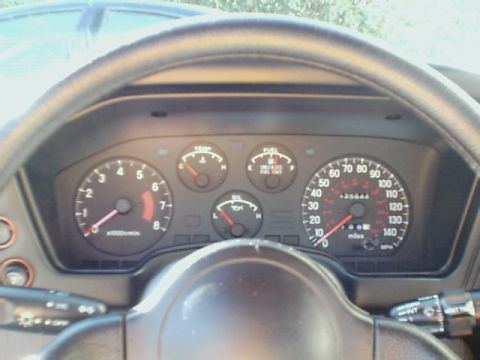 1994 Eagle Talon - Interior view of a 1994 Eagle Talon's dashboard, the speedometer and tachometer.