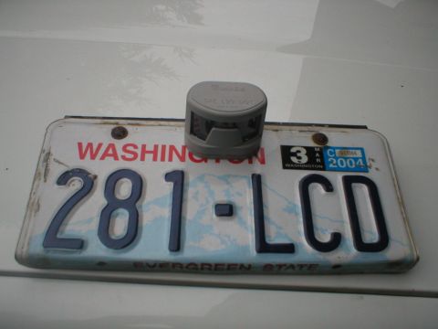 1978 Ford Bronco - A Washington state license plate is shown with a small gray device mounted on top of it.