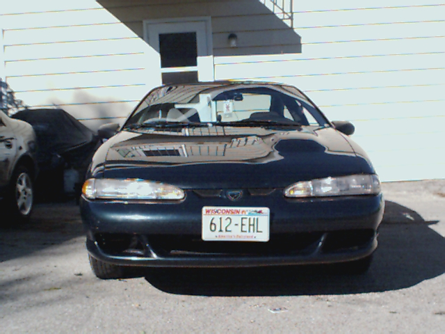 1994 Eagle Talon front view, parked in driveway. Another car is covered on the left