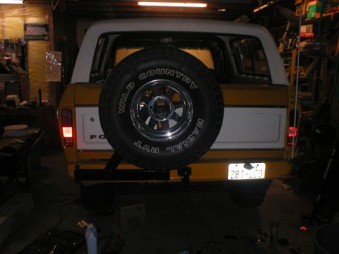 1978 Ford Bronco - The rear of a 1978 Ford Bronco is visible, a spare tire mounted externally.