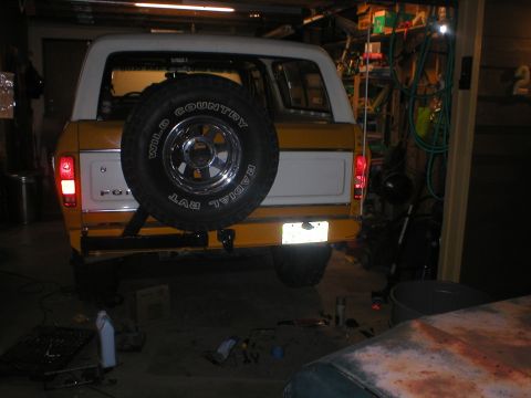 1978 Ford Bronco - Rear view of a 1978 Ford Bronco, showing the spare tire mounted on the tailgate.