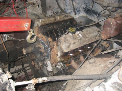 1994 Ford Bronco - Engine hoist attached to a Ford V8 engine, likely during removal or installation.