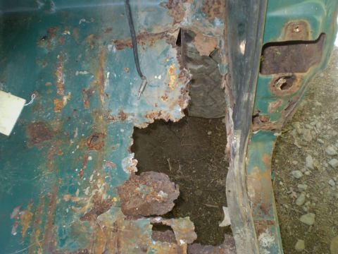 1979 Ford Bronco - This vehicle's interior shows significant rust damage, particularly on the floor and rocker panel.