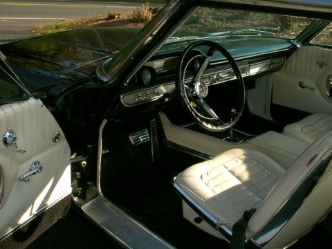 1964 Ford Galaxie - Interior view of a 1964 Ford Galaxie, highlighting its classic dashboard and seating.