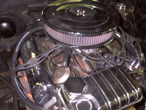 1964 Ford Galaxie - Engine bay of a 1964 Ford Galaxie, chrome valve covers and an aftermarket air cleaner.