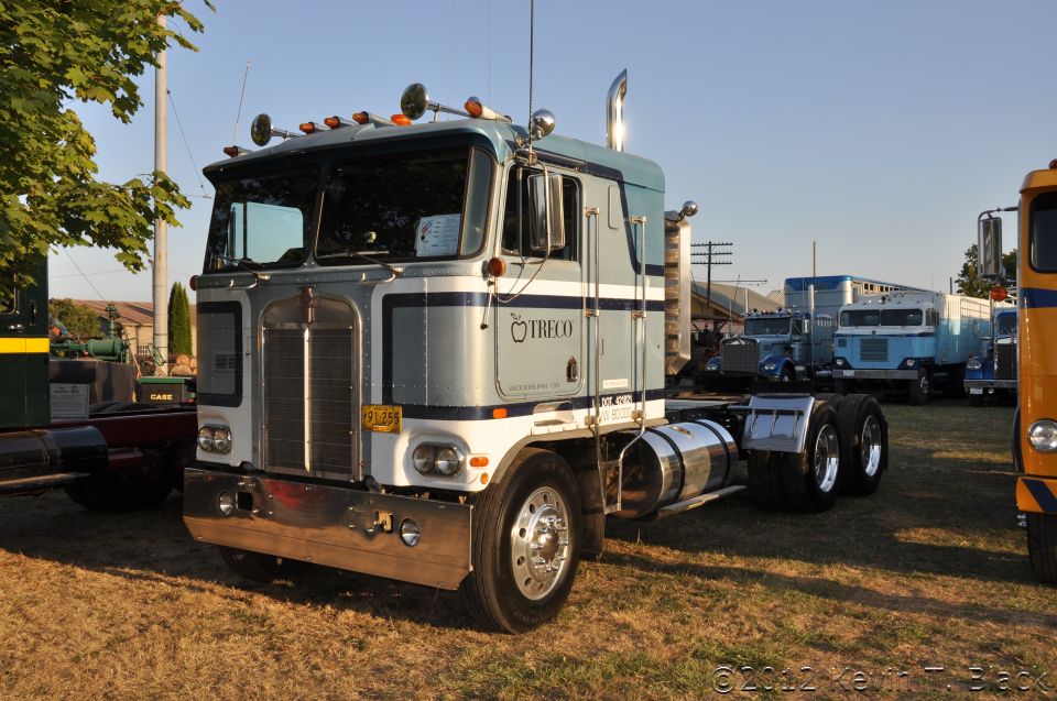 Truck with TRECO logo, parked in a lot with other trucks