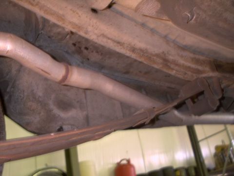 1964 Ford Galaxie - Underside view shows exhaust system components and leaf springs.