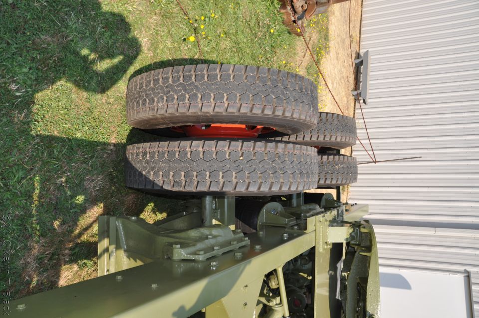 Truck chassis with dual rear wheels and orange hub
