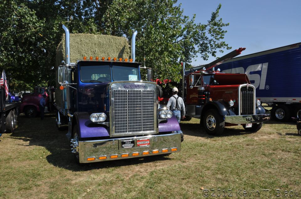 Purple and blue semi-truck with hay bale, 1959 Kenworth W900A