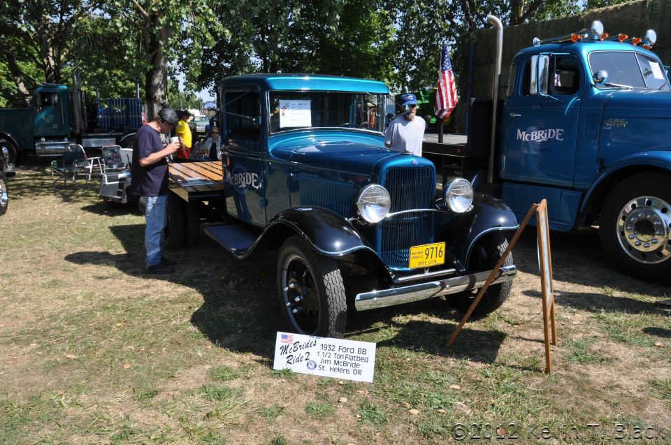 Blue 1952 Ford BB flatbed truck with yellow license plate 9716