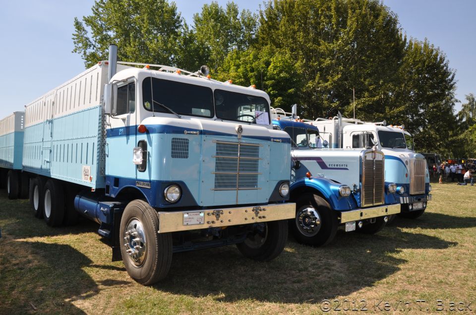 1959 Kenworth W900A semi-truck with blue and white trailer