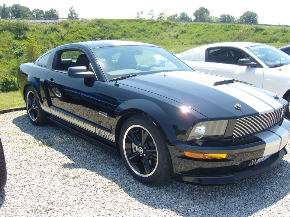 Black 2007 Ford Mustang Shelby GT with white stripes