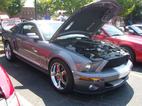 2007 Ford Mustang - A gray Ford Mustang GT/SS is displayed with its hood open at a car show.
