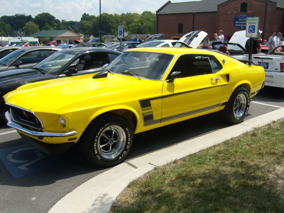 Yellow 1969 Ford Mustang Boss 302 with black stripe