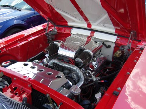 2007 Ford Mustang - Engine bay of a custom car with a V8 engine, chrome intake, and red and white striped hood, with another car visible in the background.