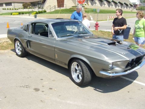 2007 Ford Mustang - A classic gray 1967 Ford Mustang GT350 is displayed at an outdoor event.