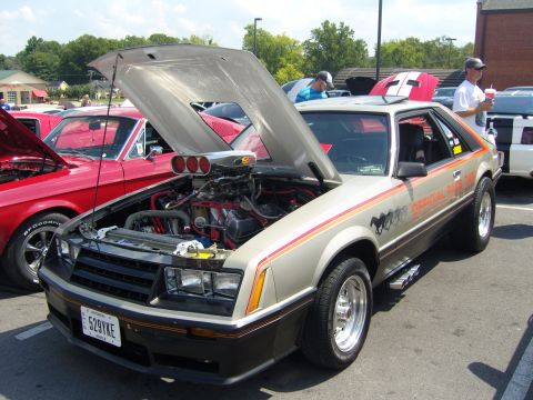 2007 Ford Mustang - A modified 1980s Ford Mustang with its hood up at a car show.