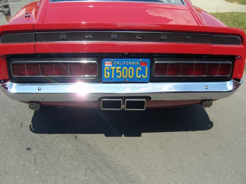 2007 Ford Mustang - Rear view of a red 1967 Shelby GT500 CJ, identified by its distinctive taillights and badging.