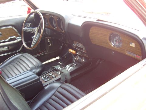2007 Ford Mustang - Interior view of a classic car showing the dashboard, steering wheel, and seats.