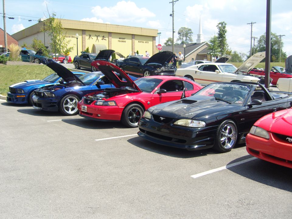 Black 1994 Ford Mustang convertible with hood up