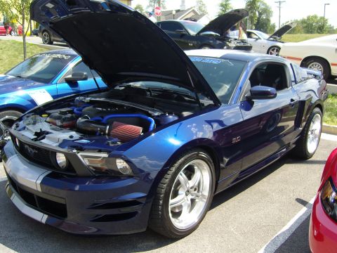 2007 Ford Mustang - Blue 2007 Ford Mustang at a car show, hood raised to display the engine.