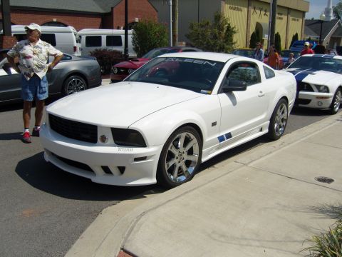 2007 Ford Mustang - A white Saleen Mustang is parked on the street, with another Mustang visible behind it.