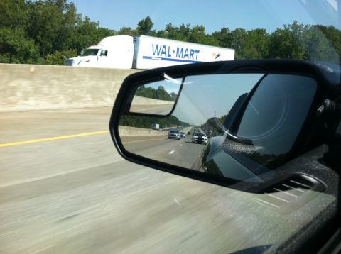 2007 Ford Mustang - Highway scene with a Walmart truck and cars visible in the side mirror.