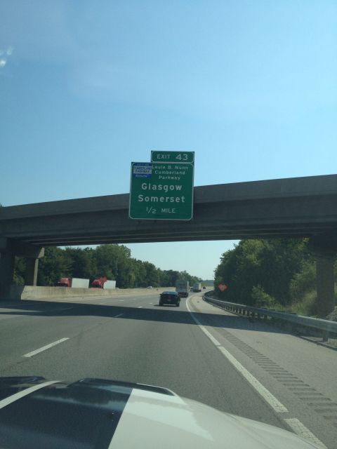 2007 Ford Mustang - Driving on a highway under an overpass with an exit sign indicating Glasgow and Somerset.