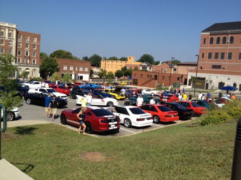 2007 Ford Mustang - A gathering of Ford Mustangs at a car show, with several models visible.