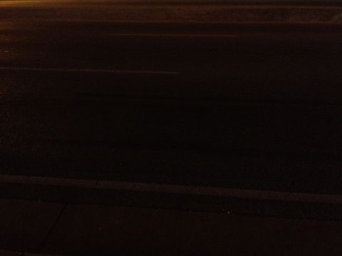 2007 Ford Mustang - A dark road scene at night, with no discernible vehicles or identifying features.