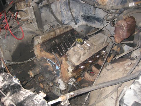 1994 Ford Bronco - Close-up view of a V8 engine in a vehicle's engine bay, showing mechanical components and wiring.