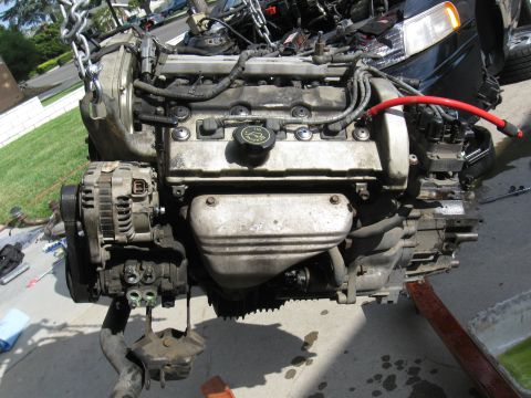 1992 Ford Taurus - Engine assembly removed from a vehicle, possibly for repair or rebuild.