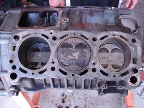 1992 Ford Taurus - Close-up view of an engine block's cylinders and pistons, with visible markings like 'BR' and 'GR'.