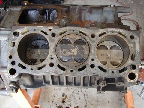 1992 Ford Taurus - Close-up of an engine block with pistons, indicating internal engine wear.