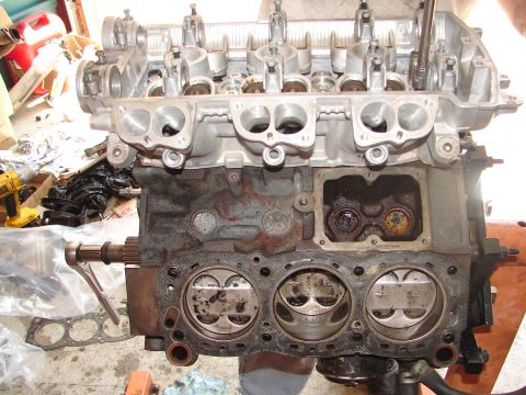 1992 Ford Taurus - Disassembled engine block showing pistons and cylinder bores, with cylinder head off.